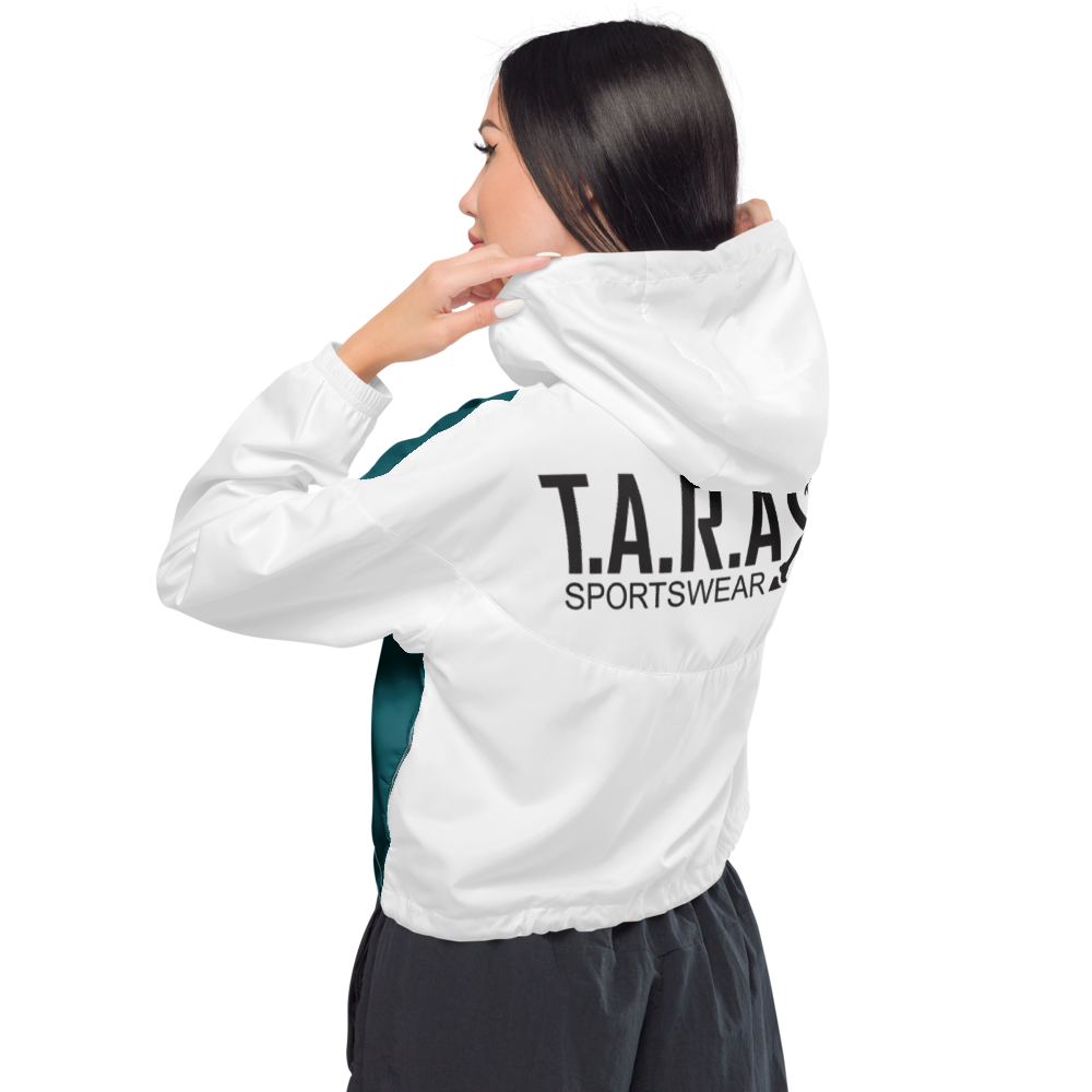 Person wearing a white jacket and black leggings on a white background