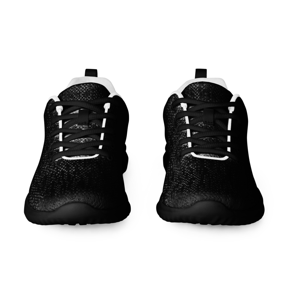 Black sneakers with white soles on a white background