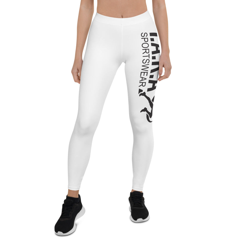 A model wearing high waisted white sportswear leggings with a logo on the side, paired with black sneakers.