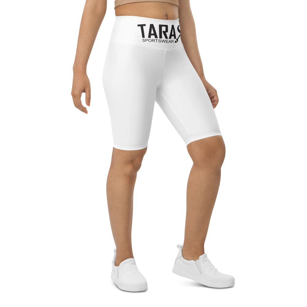 A model wearing T.A.R.A Sportswear high-waisted white biker shorts with a visible brand logo on the waistband.