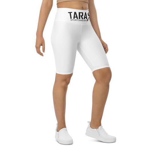 A model wearing T.A.R.A Sportswear high-waisted white biker shorts with a visible brand logo on the waistband.