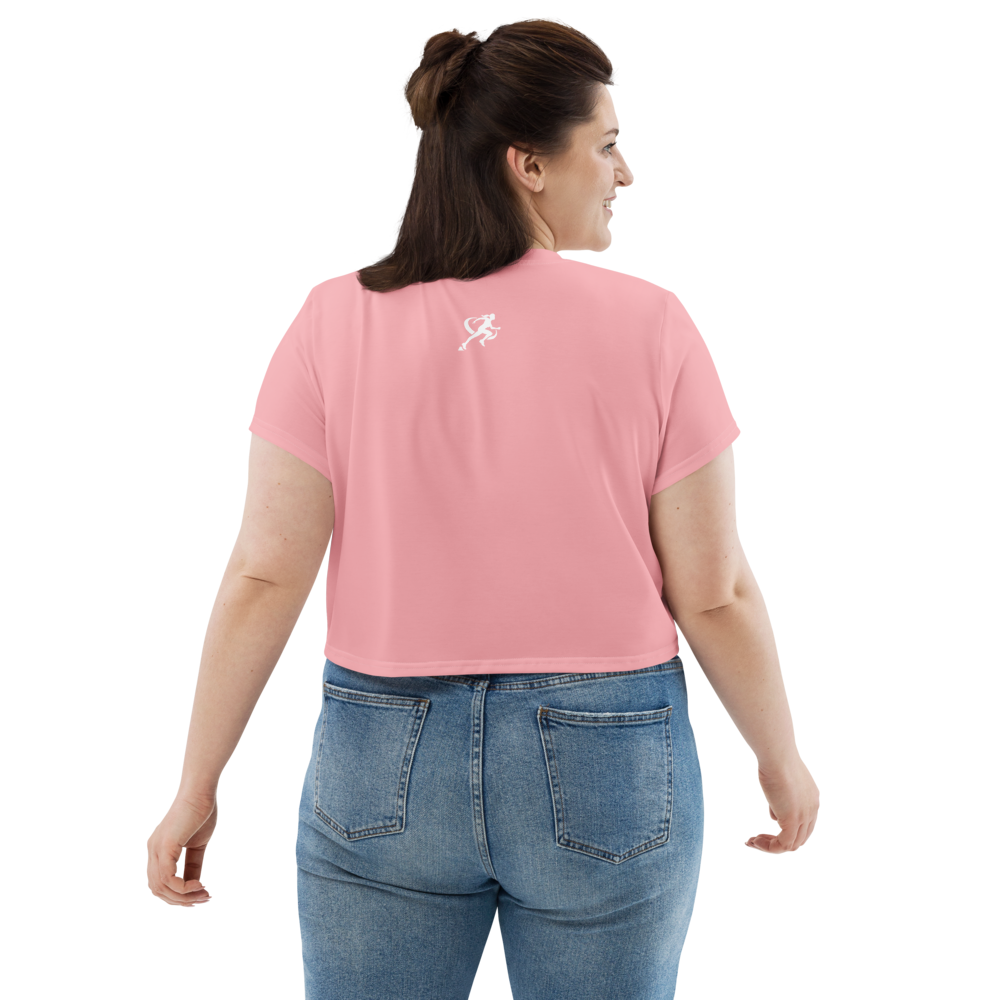 Woman wearing a pink t-shirt with 'TARA' printed on it against a white background