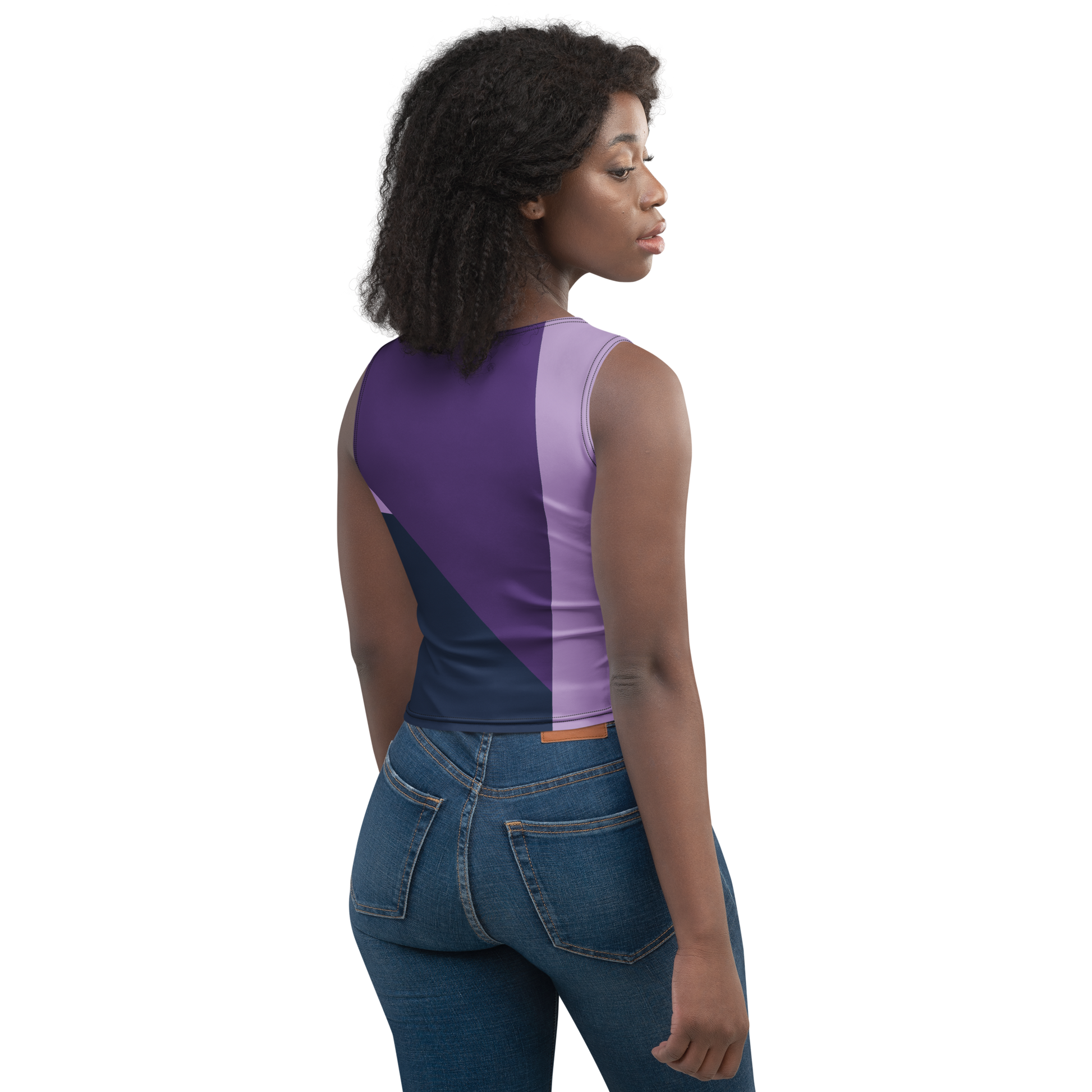 Woman wearing a purple tank top and blue jeans on a white background