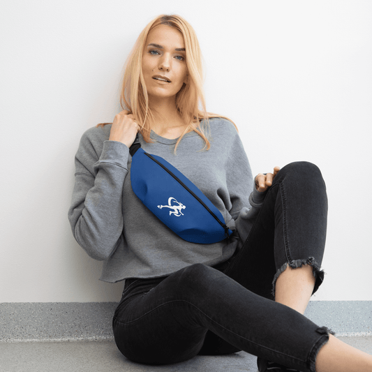Woman sitting on the floor with a blue fanny pack featuring a logo.