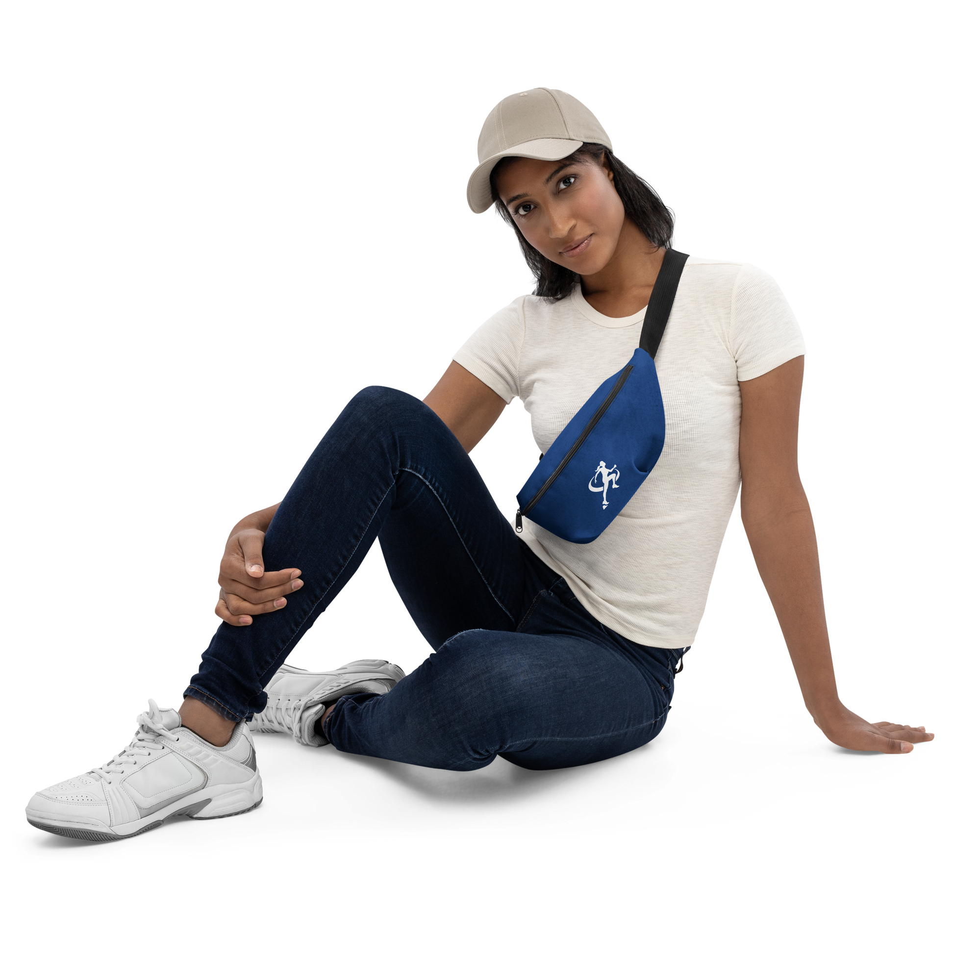 Woman sitting on the floor with a blue fanny pack featuring a logo.