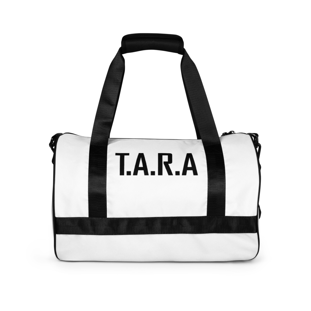 White duffel bag with black straps and 'T.A.R.A.' text on a white background