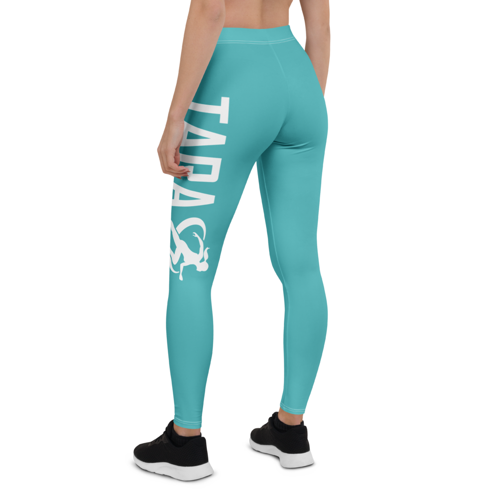 Woman in athletic wear standing on a running track