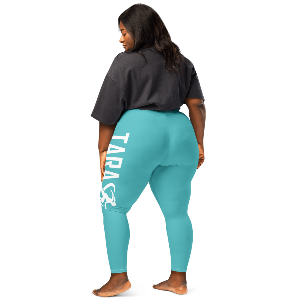 Woman in athletic wear standing on a running track