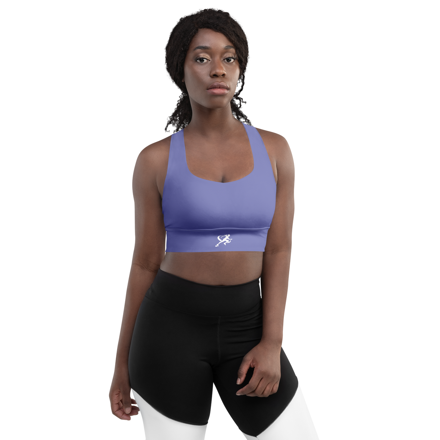 Woman wearing a purple sports bra and black leggings on a white background