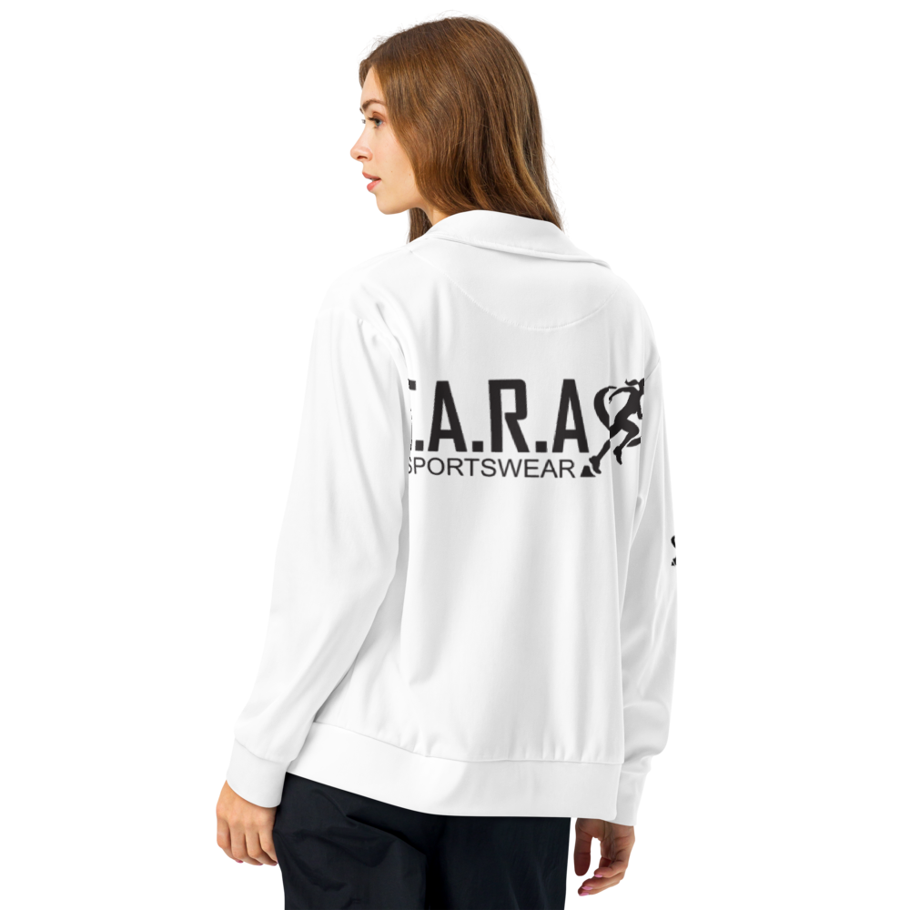 A woman standing wearing white T.A.R.A Sportswear Classic Gym Jacket with black logos on the back