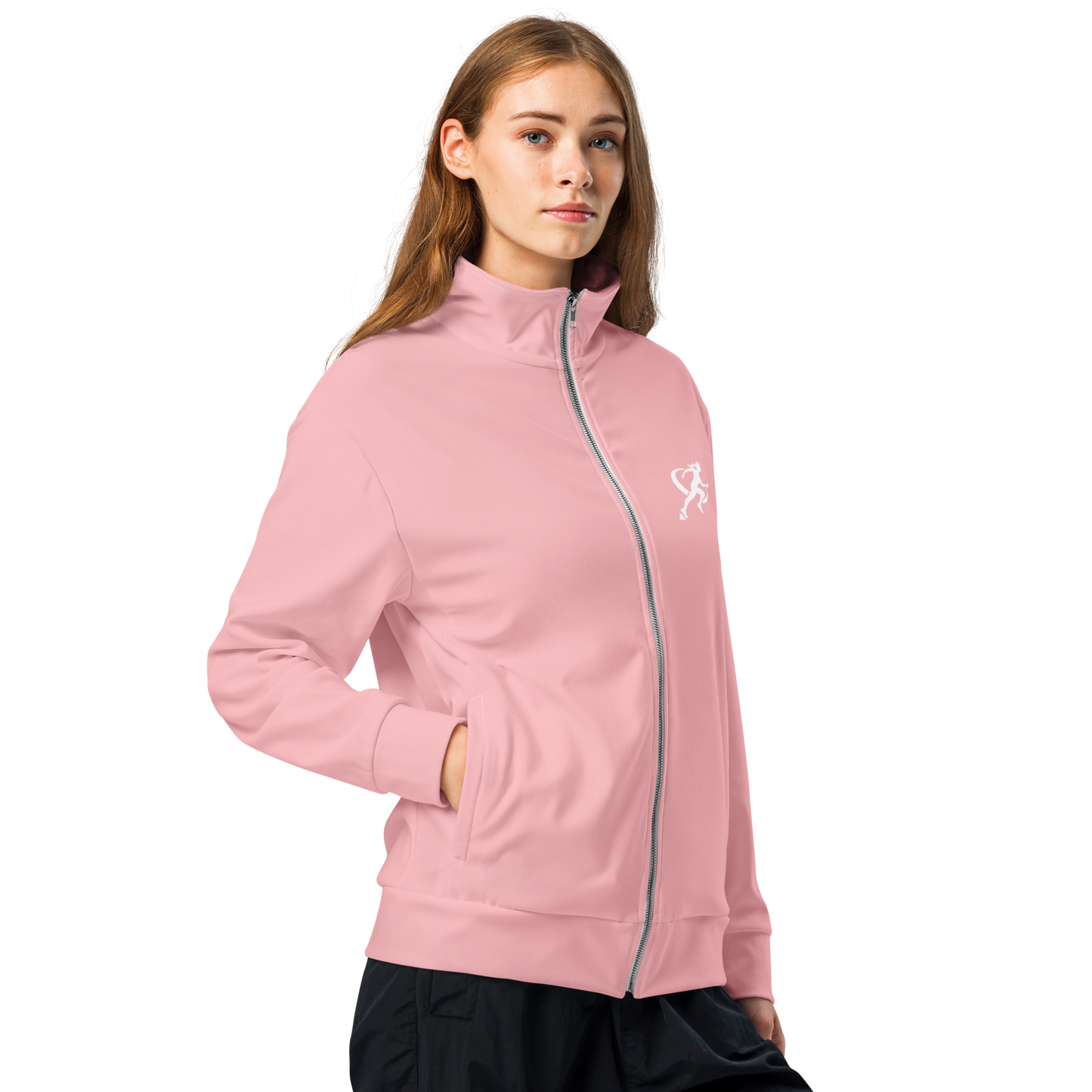 Woman wearing a pink jacket and black pants on a white background