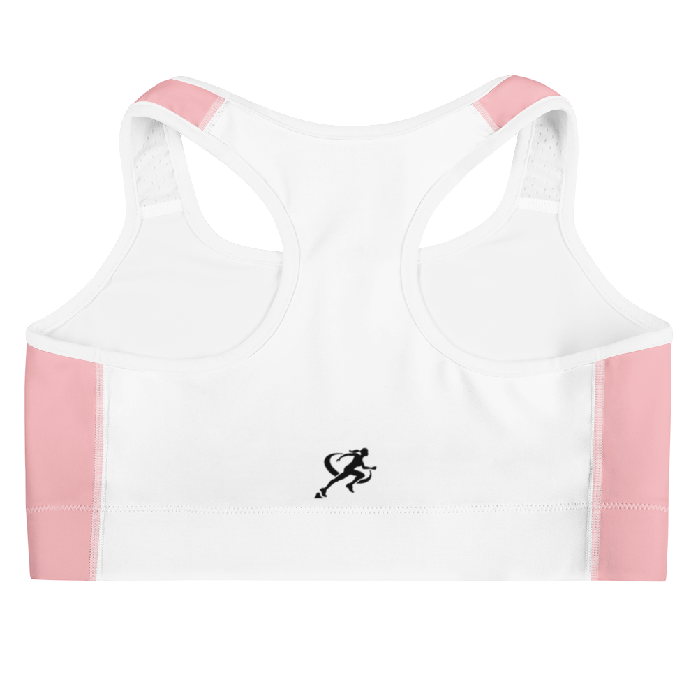 Woman wearing a pink sports bra and beige leggings on a white background