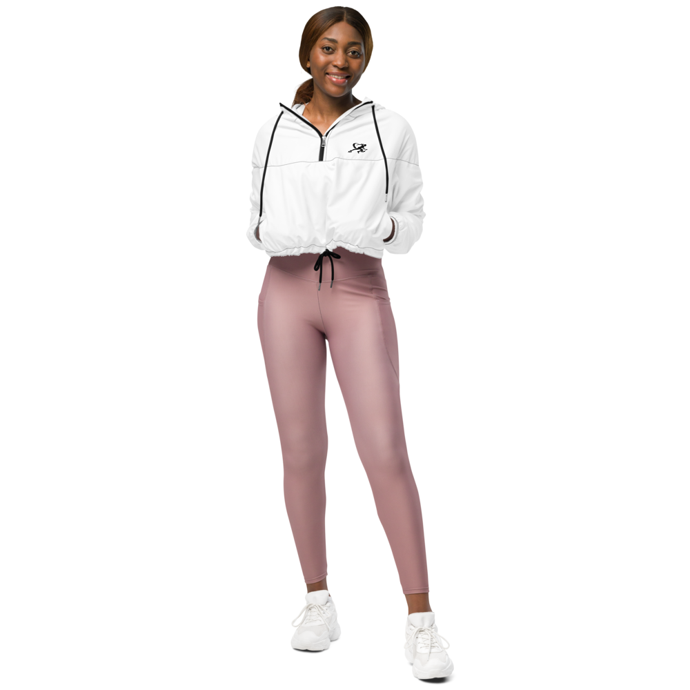 Person wearing a white jacket and pink leggings on a white background