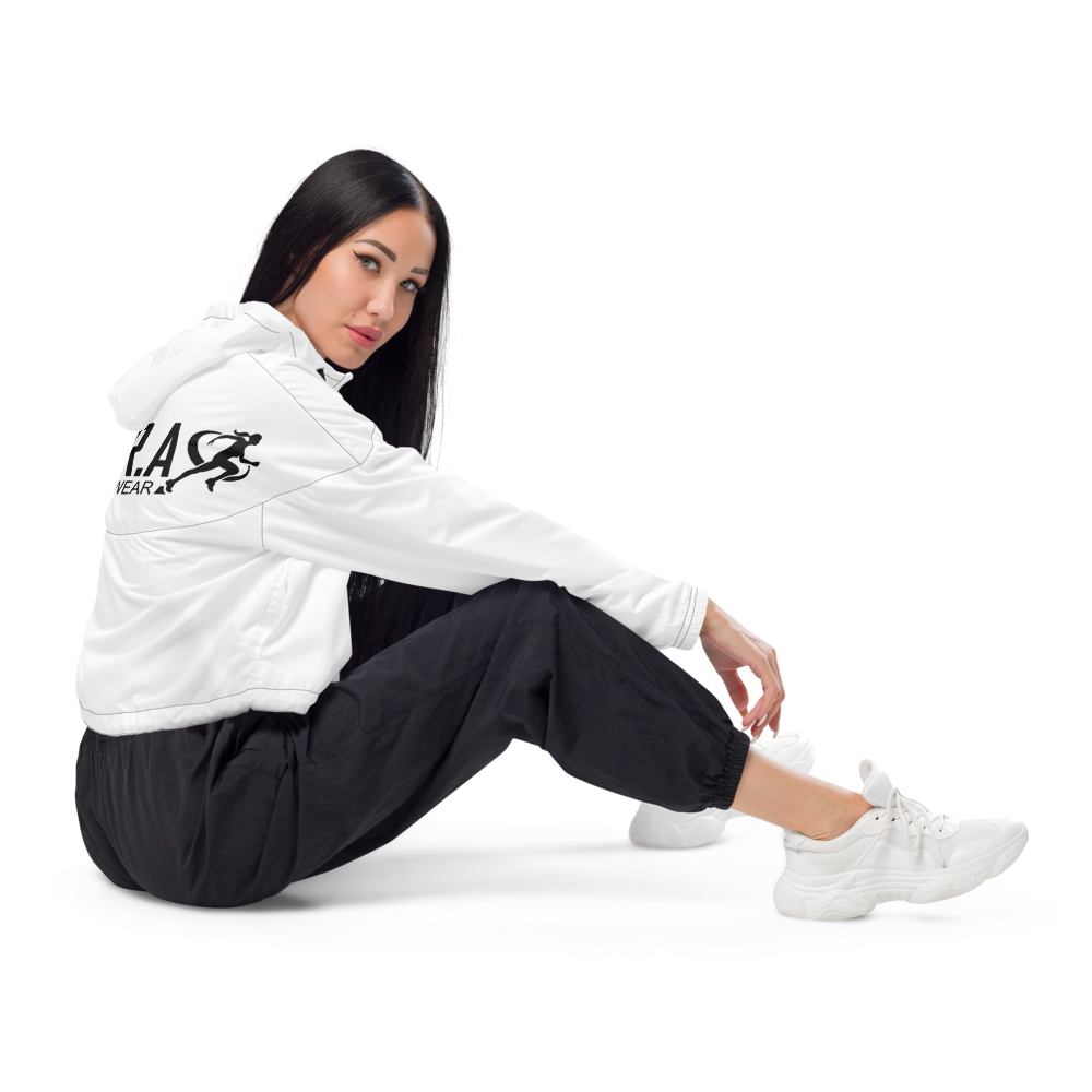 Person wearing a white jacket and black leggings on a white background
