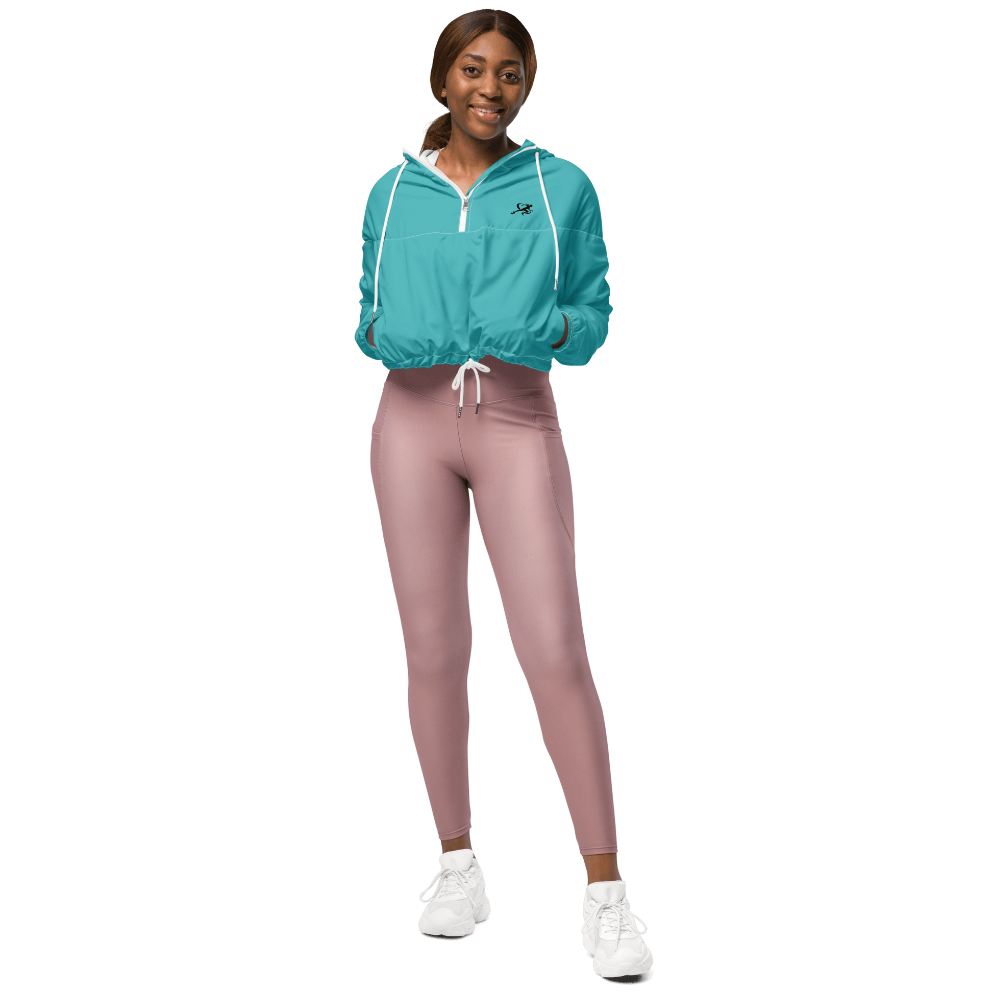 Woman wearing a turquoise jacket and black pants on a white background