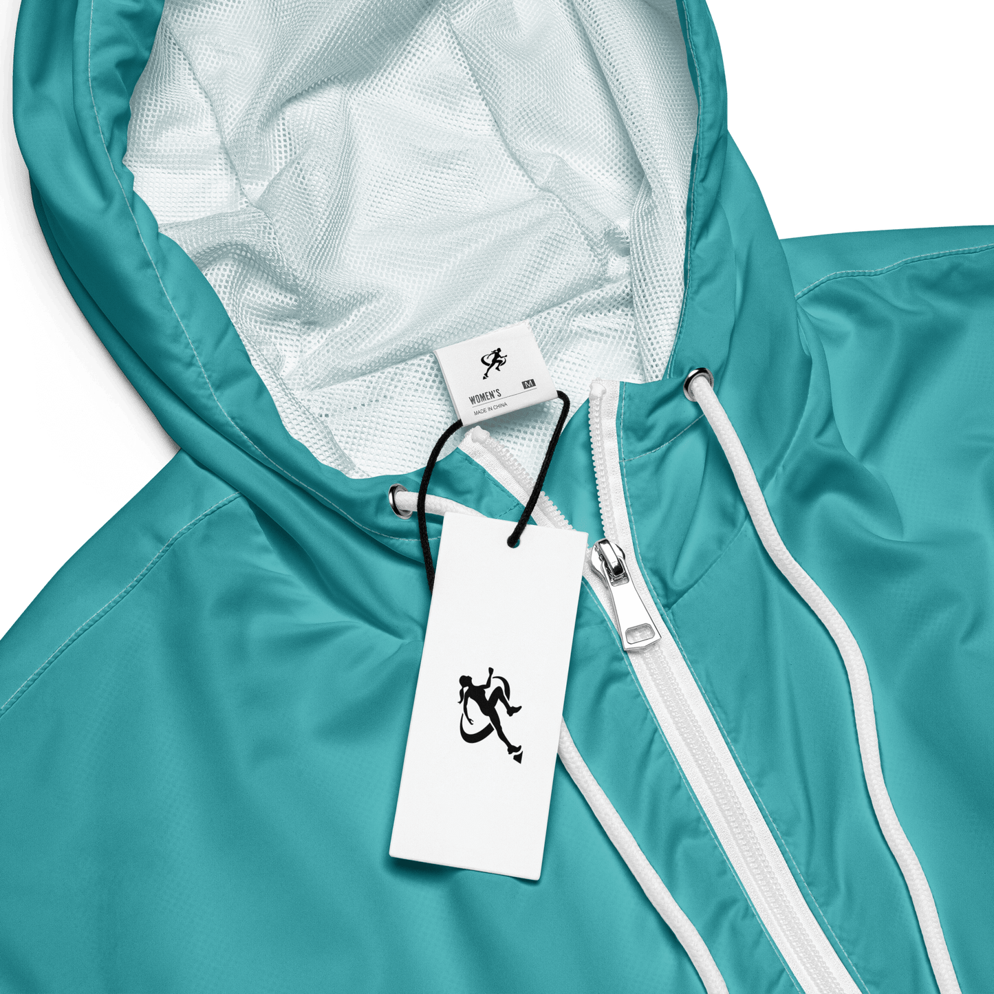 Woman wearing a turquoise jacket and black pants on a white background