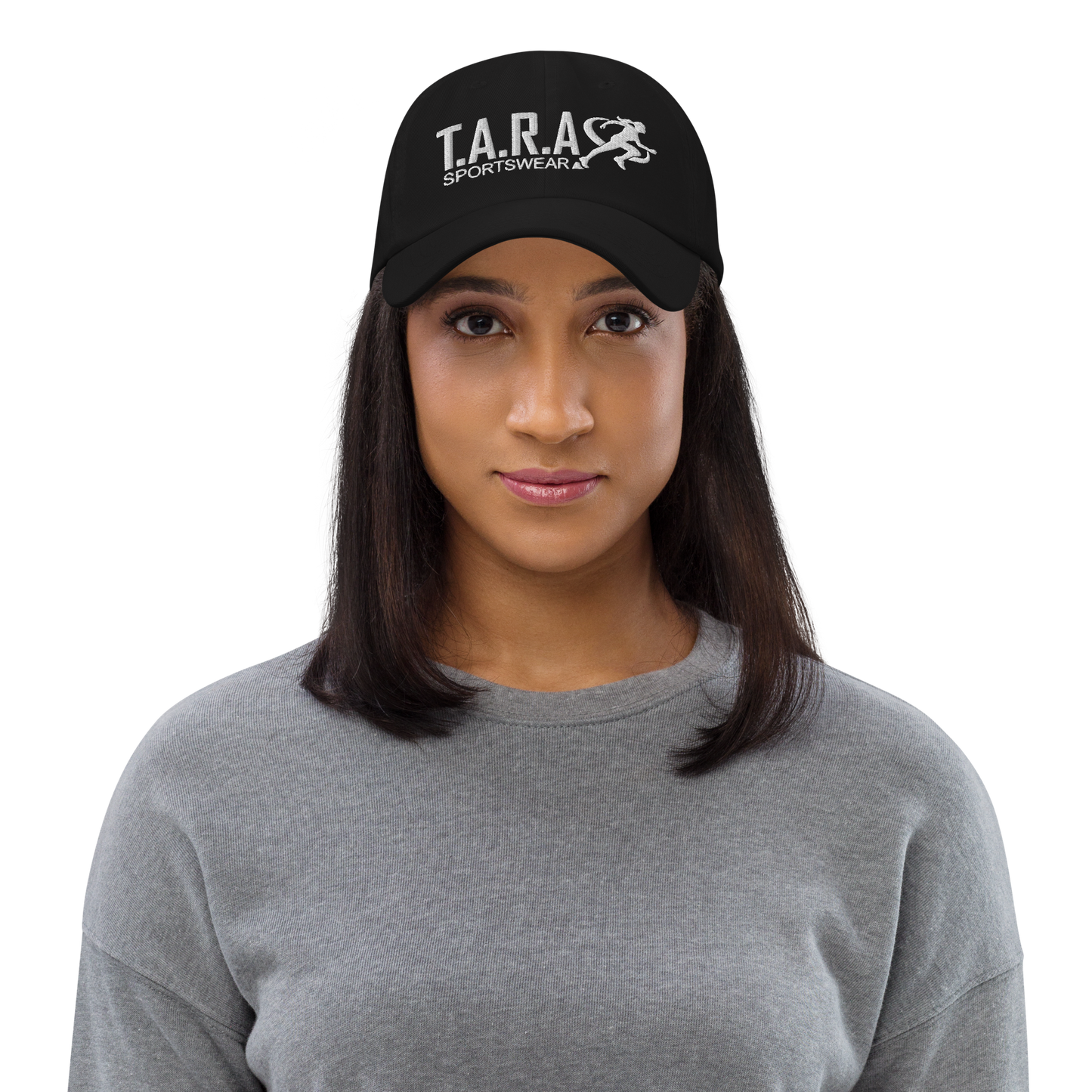 A woman wearing a black cap with the logo 'T.A.R.A Sportswear' on the front.