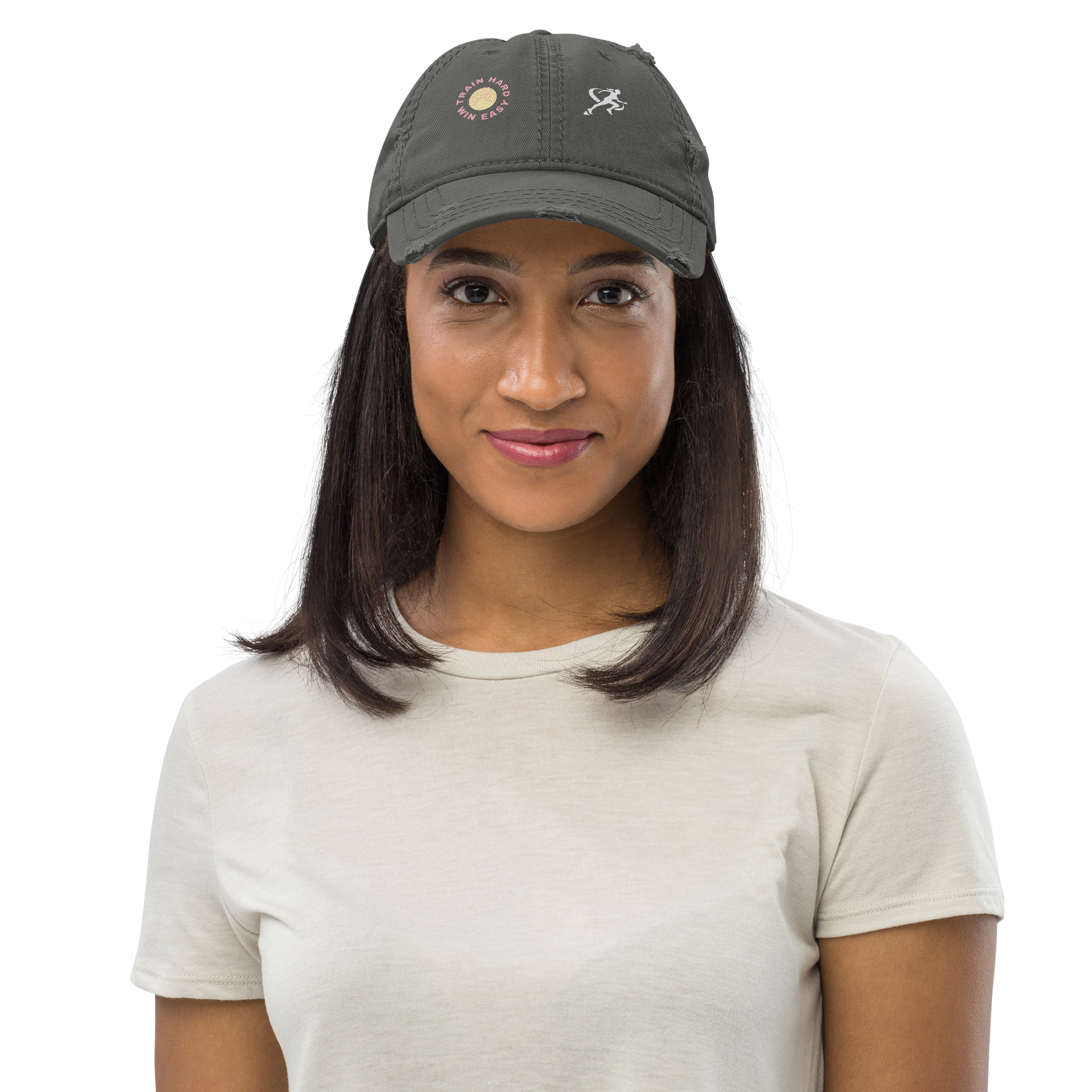 Woman wearing a dark gray cap with embroidered designs on a white background