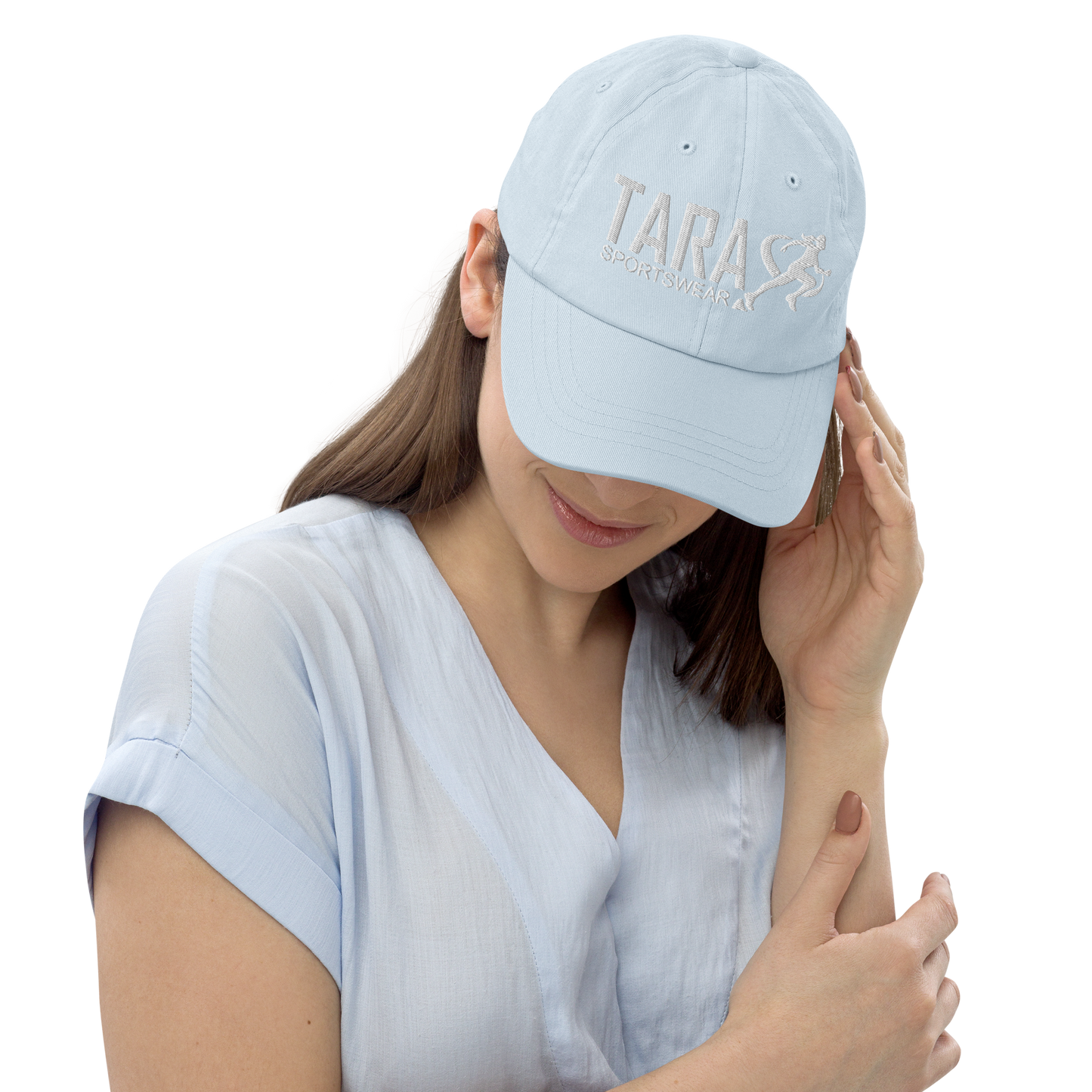 Woman wearing a pastel blue cap with a logo on a white background