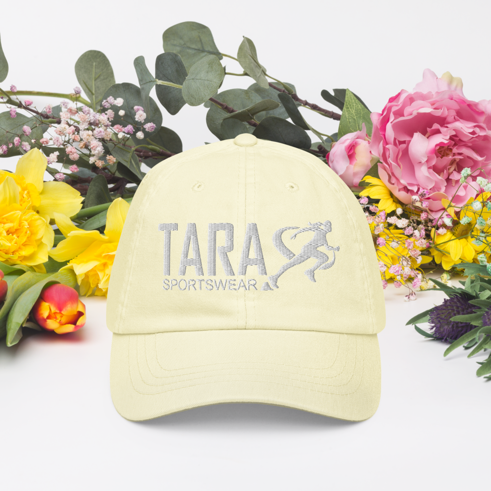 A light yellow cap with a logo on a white background
