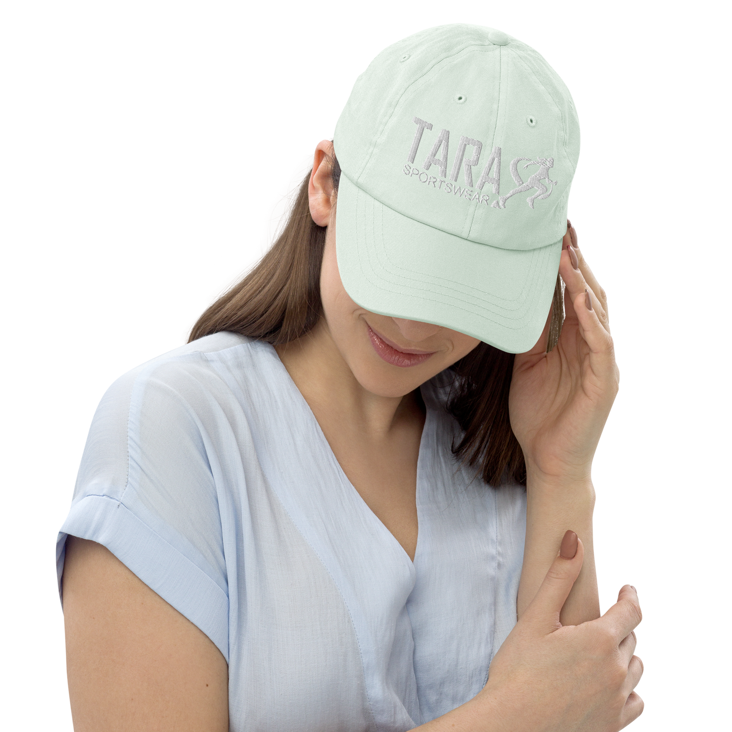Woman wearing a mint cap with a logo on a white background