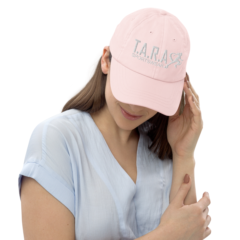 Woman wearing a pink cap with a logo on a white background