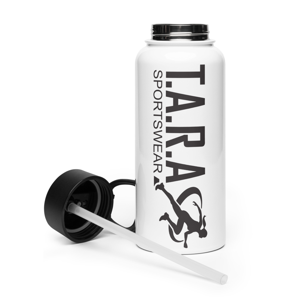 A white 32 oz (950 ml) water bottle with a black plastic lid and a wide-mouth foldable straw, lying on a rocky surface with a blurred background.