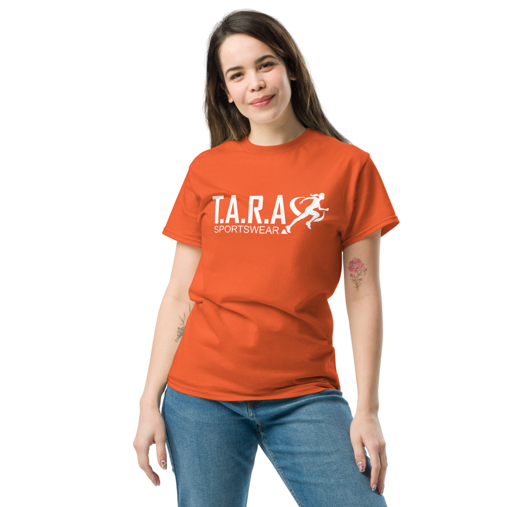 A woman wearing a orange T-shirt with the logo 'T.A.R.A Sportswear' on the front.