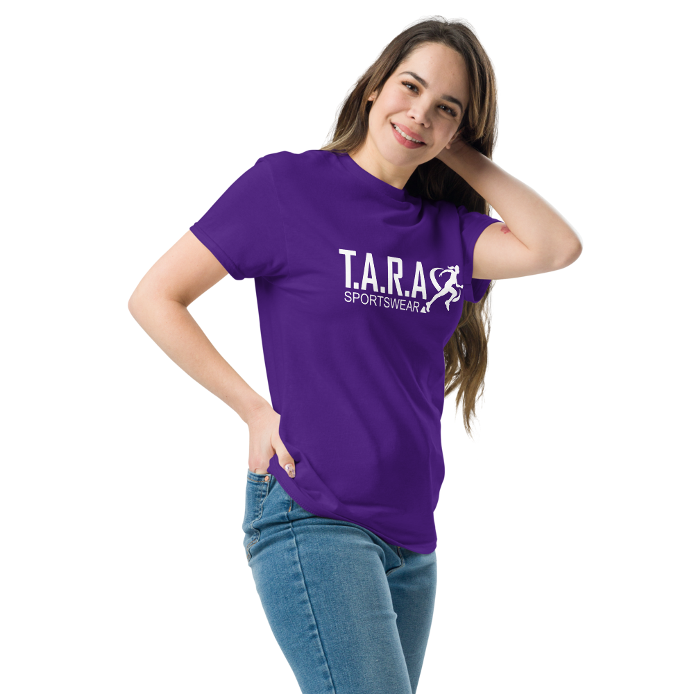 A woman wearing a purple T-shirt with the logo 'T.A.R.A Sportswear' on the front.