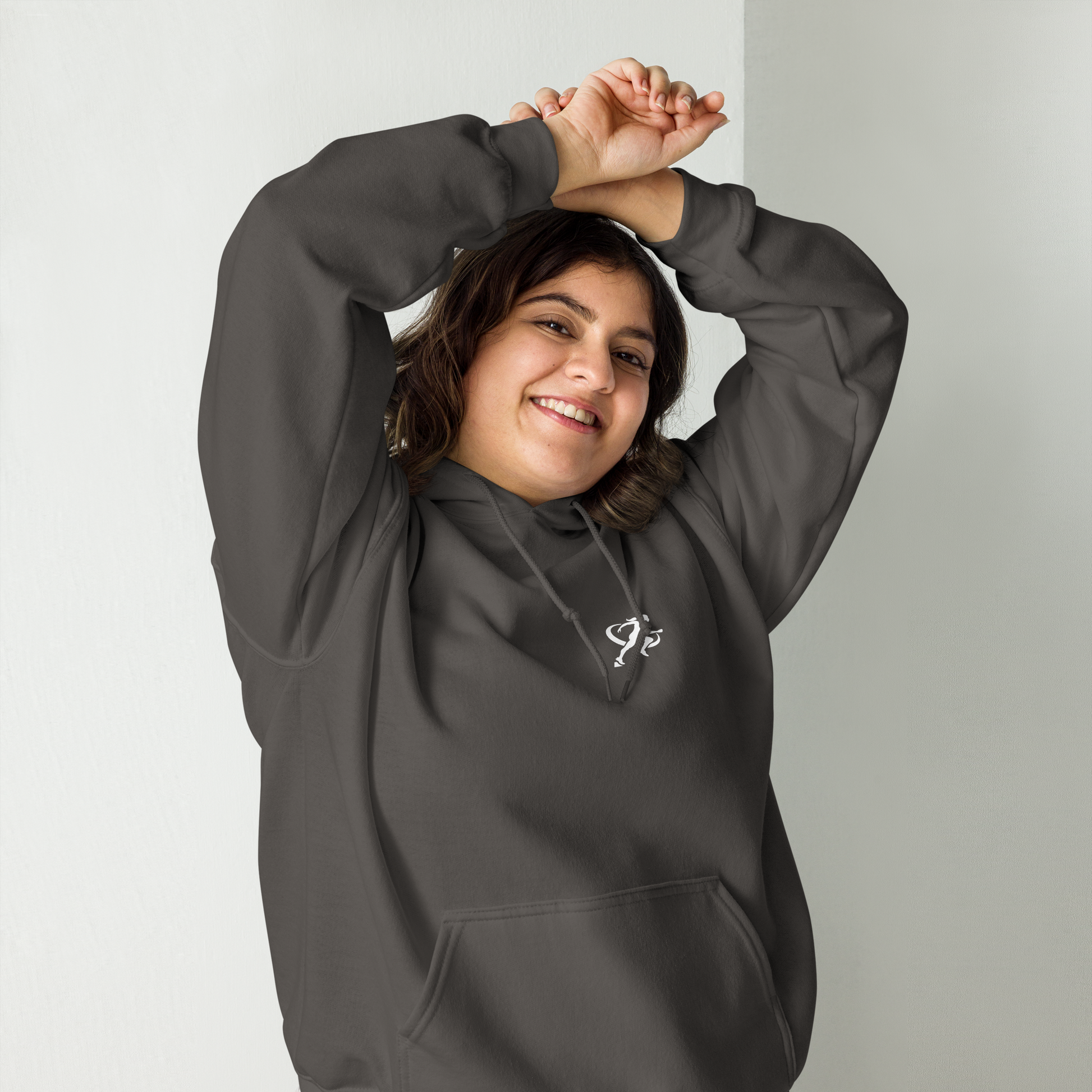 A woman wearing a gray Sweatshirt with a white background