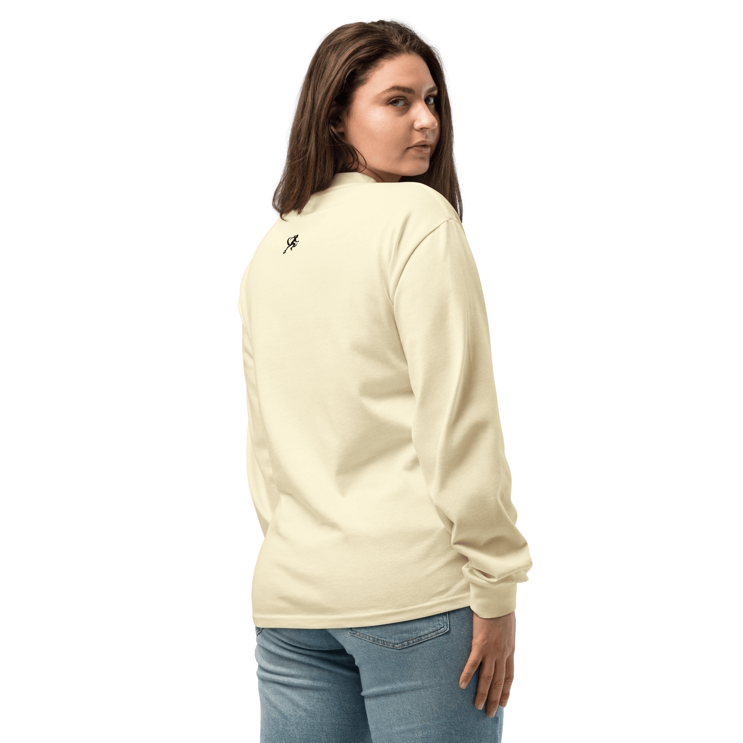 Person wearing a white sweatshirt with 'TARA SPORTSWEAR' logo against a brick wall.