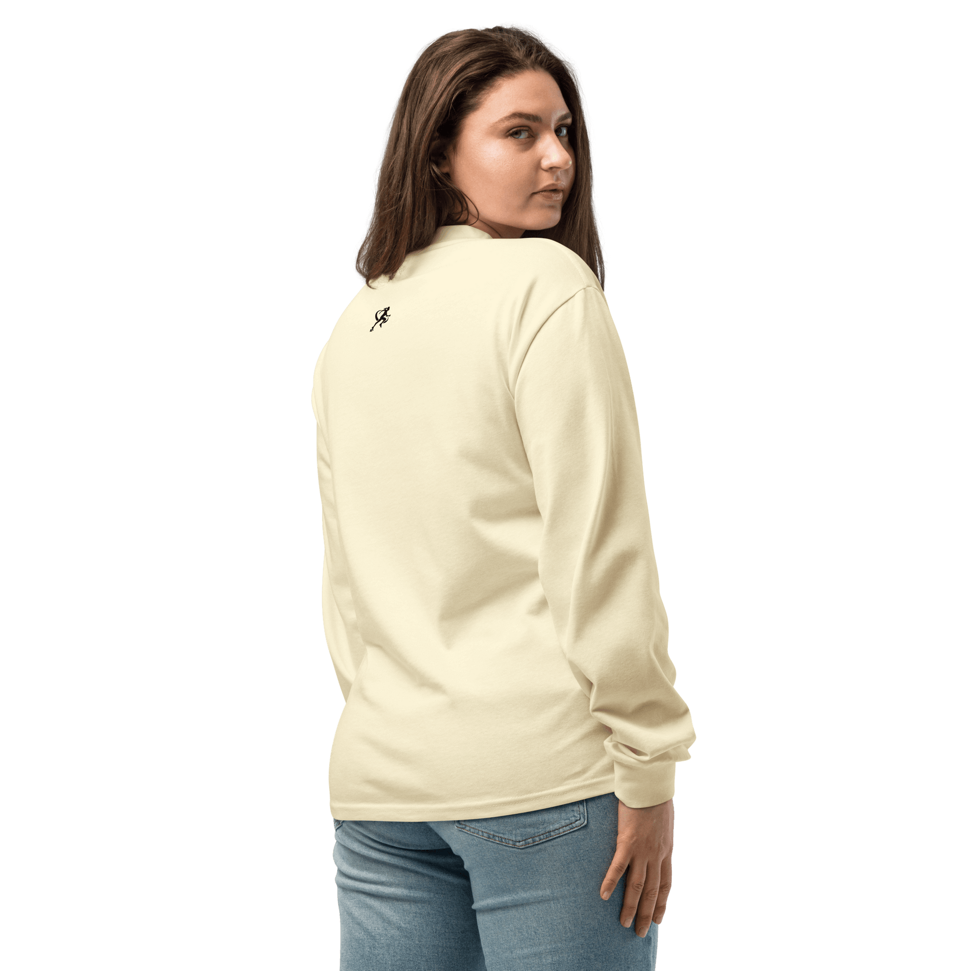 Person wearing a white sweatshirt with 'TARA SPORTSWEAR' logo against a brick wall.