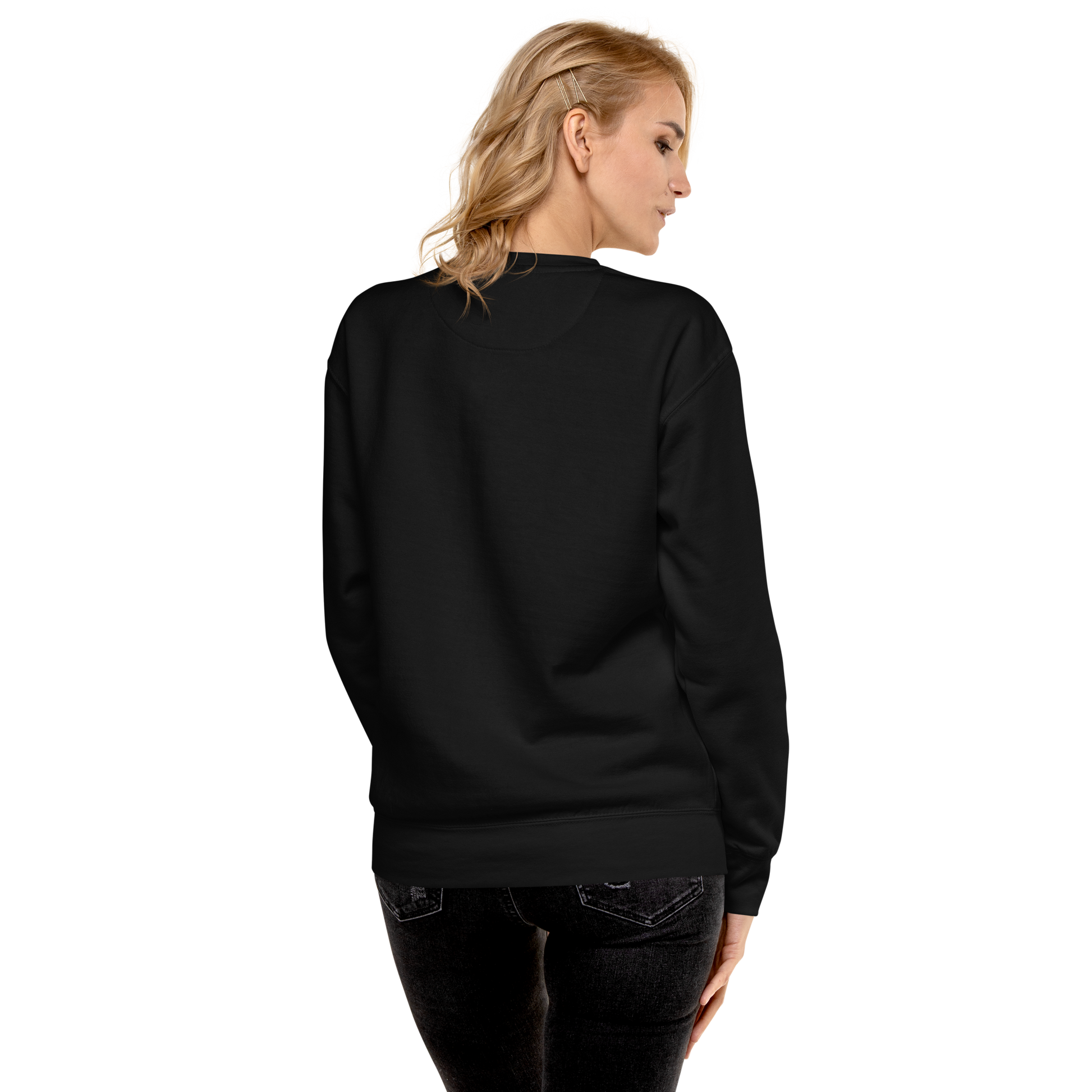 Woman wearing a black sweatshirt with a white logo on a white background