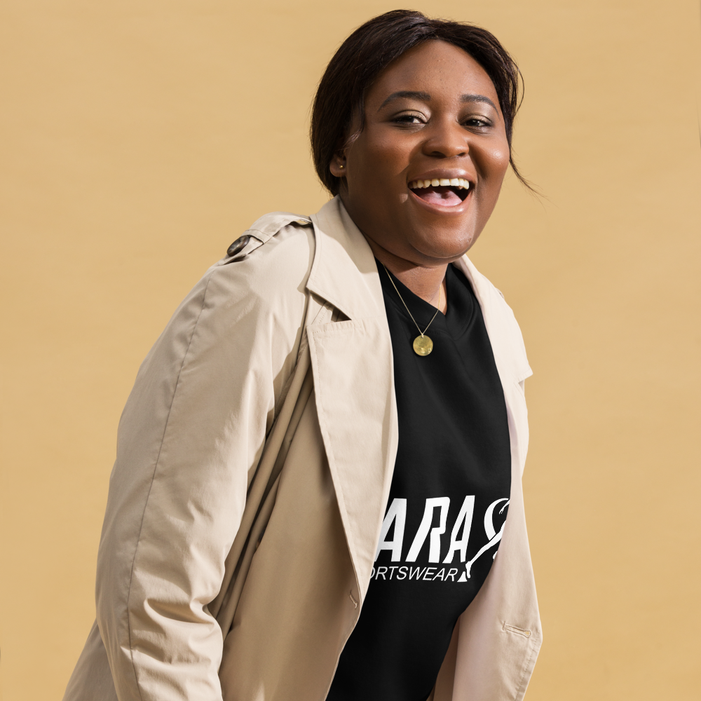 Person wearing a TARA Sportswear black sweatshirt with a white jacket 