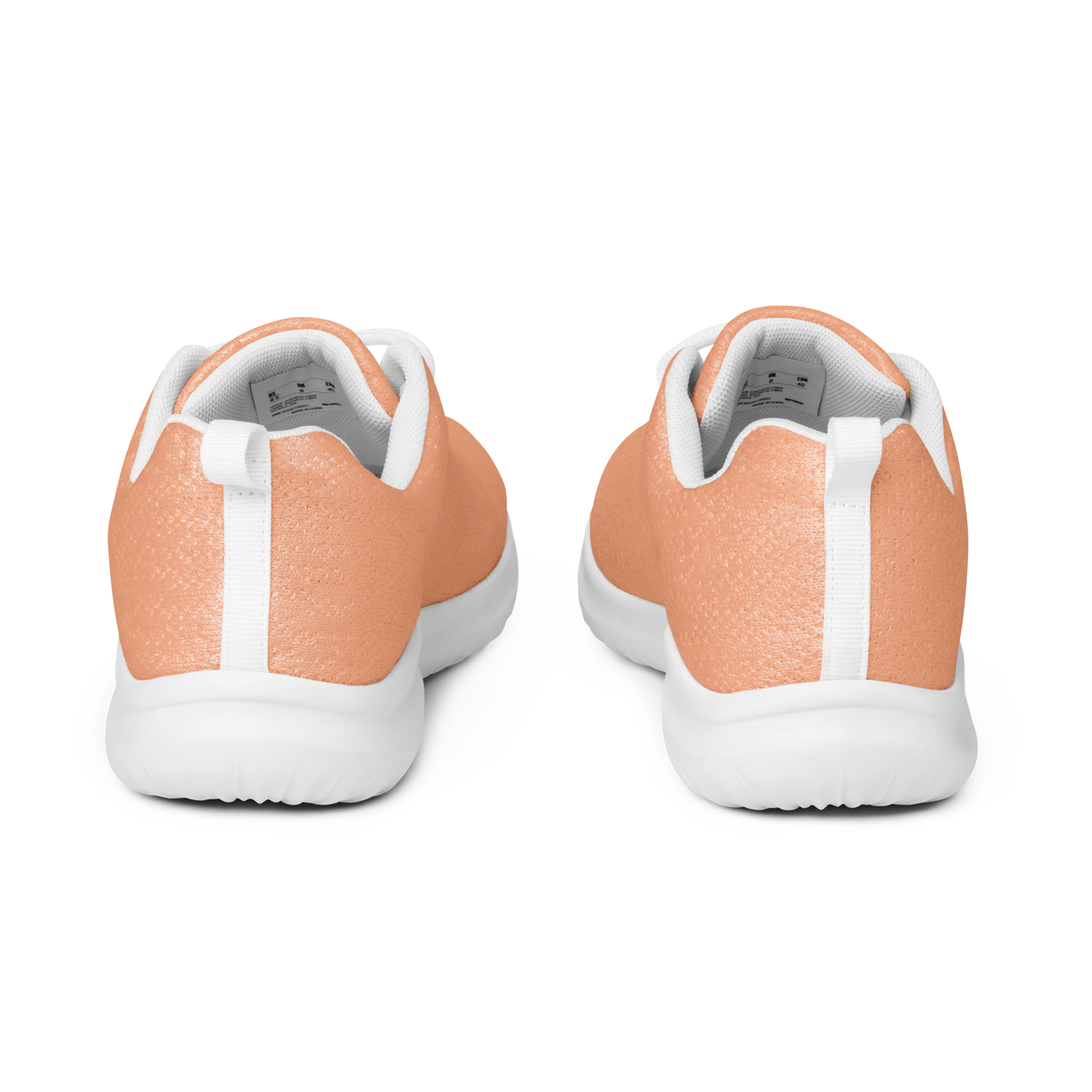 Coral running shoe with white laces on a reflective surface