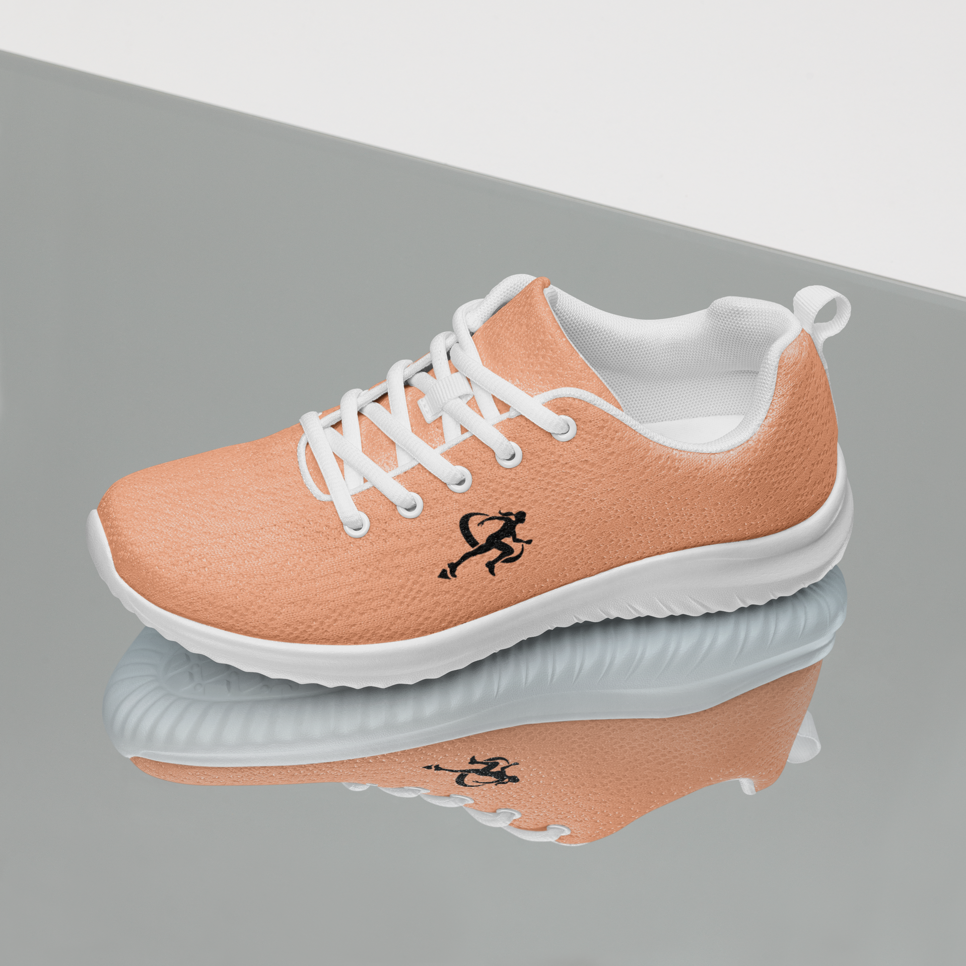 Coral running shoe with white laces on a reflective surface